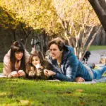 happy parent and child spending time together outdoors