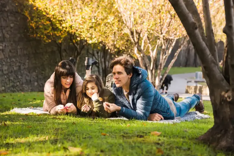 happy parent and child spending time together outdoors