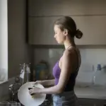 woman washing dishes faster kitchen hack