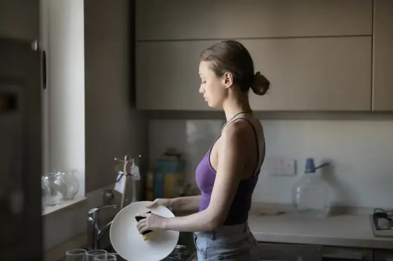 woman washing dishes faster kitchen hack