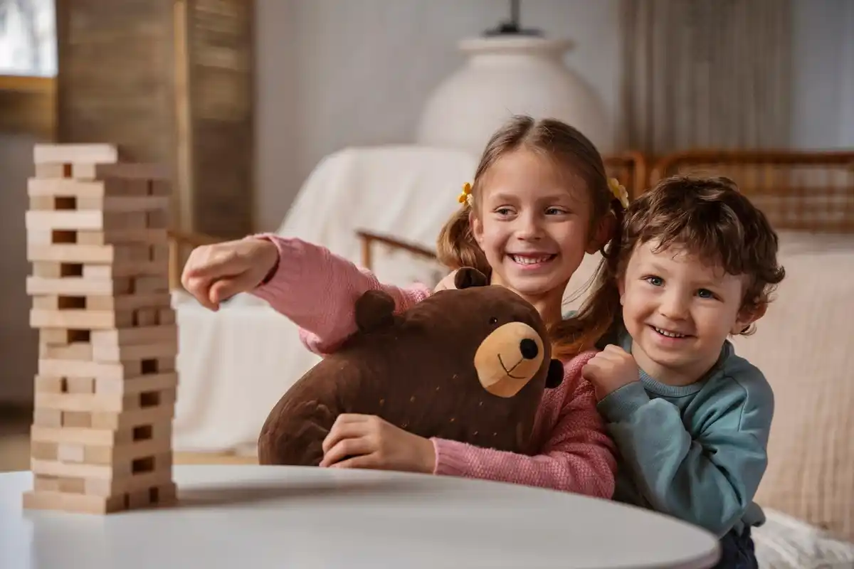 children playing quiet activities at home